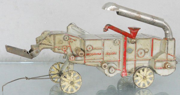 ARCADE McCORMICK DEERING THRESHER: painted cast iron, 11 1/2" long, C5-6.
