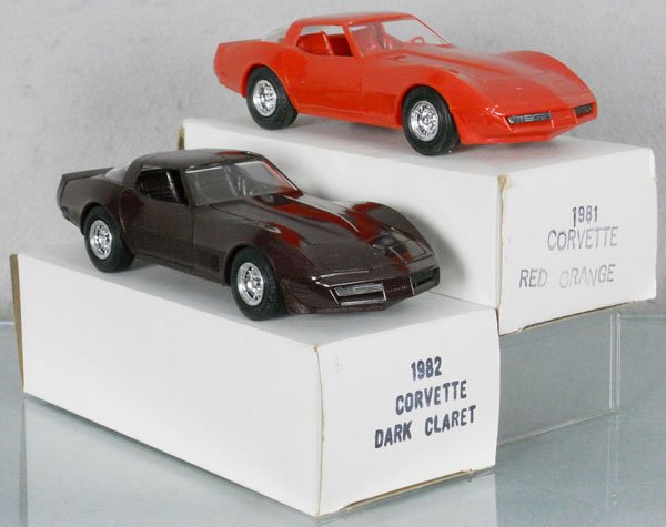 2 MPC CORVETTE PROMOS: plastic, 1982 dark claret, 1981 red orange, orig boxes minor wear, C9.