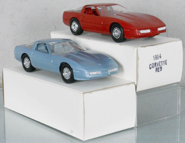 2 MPC CORVETTE PROMOS: plastic, 1985 light blue, 1984 red, orig boxes, C9.
