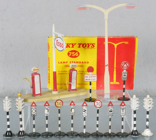 DINKY ACCESSORIES: 756 lamp standard, orig box minor wear, 781 Esso gas pumps, 10 road signs from sets 768 & 769, 4 #47c traffic signals, C5-7.