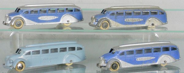 4 TOOTSIETOY 1045 GREYHOUND BUSES: 2 w/tin chassis, 2 have worn tires, C4-5.
