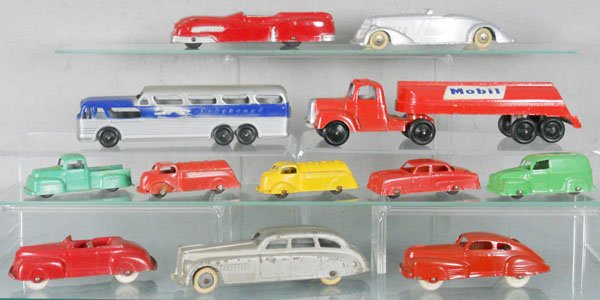 12 TOOTSIETOY VEHICLES: Chrysler Thunderbolt, 1016 Jumbo Torpedo Roadster, 1 tire broken, Greyhound Bus, w/bottom, Mobil Tanker, 1018 Jumbo Sedan, 47 Buick, 41 Chrysler, both w/wood wheels, 5 3" autos, C4-6.