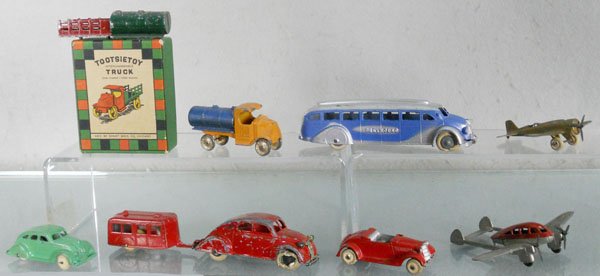 TOOTSIETOY LOT: 170 Interchangeable Truck Set, orig box missing insert, 1045 Greyhound Bus, w/tin bottom, 119 Army Plane, 118 Airflow, 1043 Camper Set, 716 Doodlebug, 719 Crusader Plane, lot has 5 worn rubber tires, 