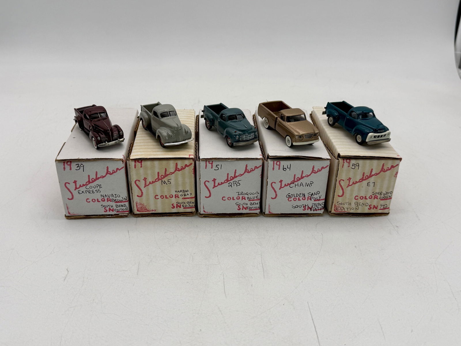 Shrock South Bend Edition (#3 of 22) Studebaker Model Pickup Truck set: Five Shrock South Bend Edition Studebaker model pickup trucks in various colors, 1:72 scale. Contains 1939 coupe Express, M5 pick up, 1951 2R5 pick up. 1959 E7 pick up, 1964 champ, all are marked sout