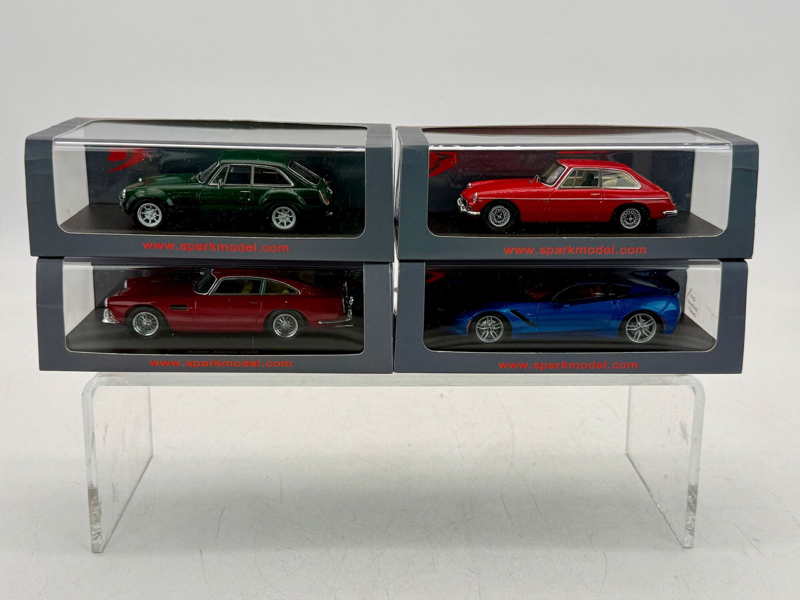 4 Spark Minimax 1:43 Model Cars: A collection of boxed resin 1:43 Spark model cars by Minimax including an MG GT Sebring 54141, MG B GT V8 54142, Aston Martin DB4 52416, and a 2014 Chevrolet Corvette 52973. Plastic OB, and sleeve, C9