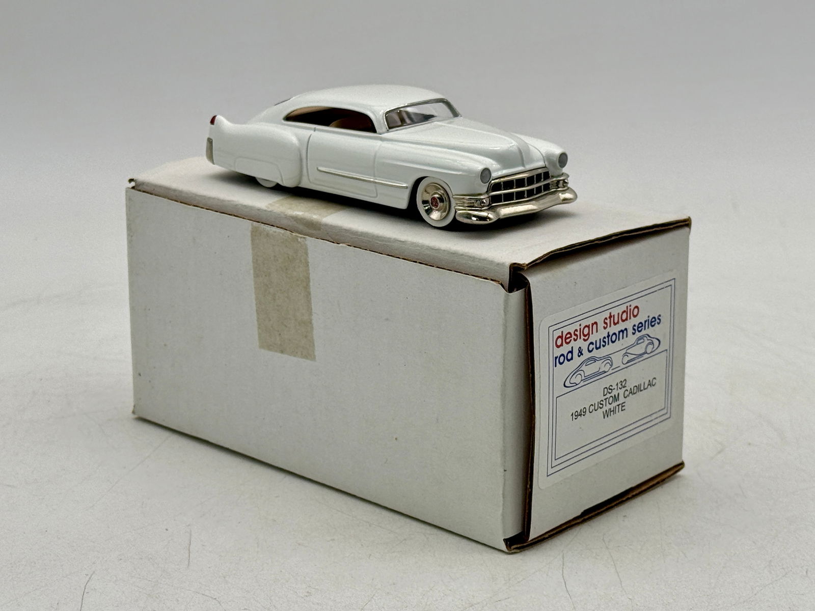 Design Studio DS-132 1949 Custom Cadillac Scale Model Car: A white metal, white 1949 custom Cadillac scale model car from the Design Studio Rod and Custom Series DS-132 with its original labeled box. OB C9
