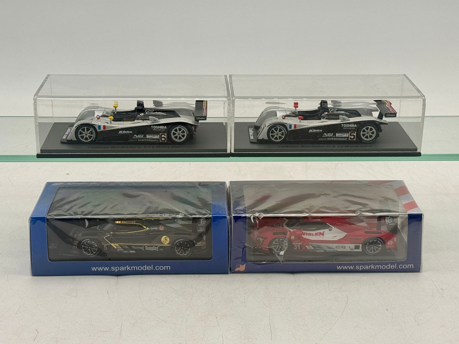 4 Spark Cadillac 1:43 Scale Model Race Cars: 4 Spark 1:43 scale model race cars including 2 Cadillac Northstar Lemans and DPi-V.R models in silver, black, and red, Mustang Sampling, and Whelen Engineering branding. US 120 Daytona 2020 sealed OB'