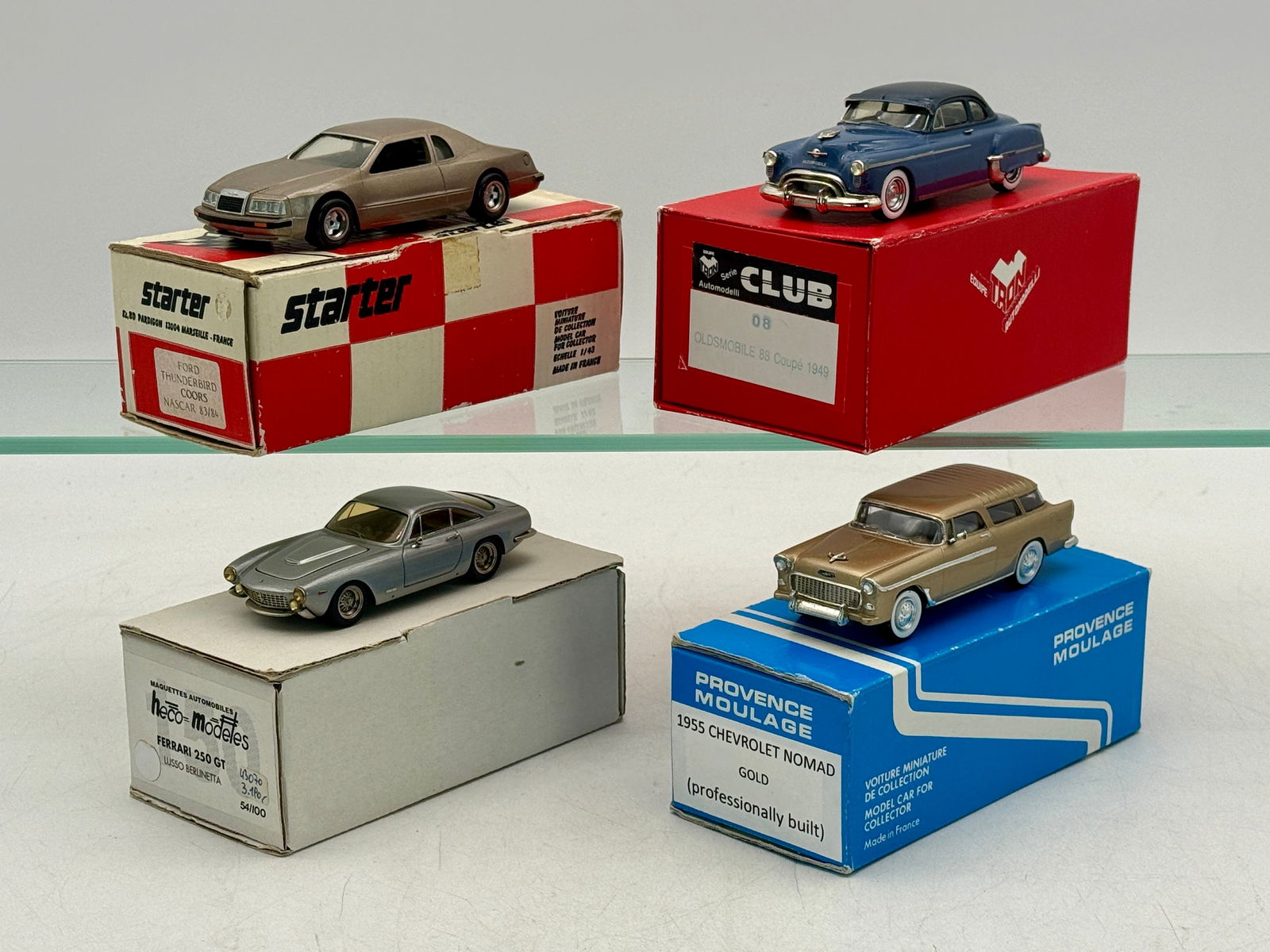 A Collection of 4 Resin vehicles: 1:43 scale , resin, TRON #8 1949 Cadillac. Starter Ford Thunderbird, Heco Ferrari 250 GT #54 of 100, Provence Moulage 1955 Chevy Nomad OB's C9
