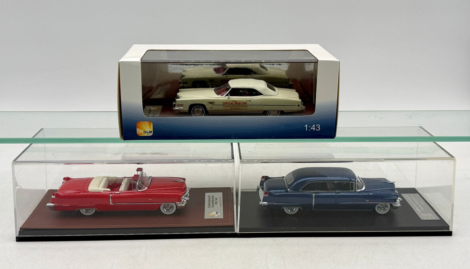 3 GLM 1:43 Scale Cadillac Model Cars: 3 GLM 1:43 scale resin model Cadillacs including 1956 Cadillac limousine, 1956 Cadillac convertible number 148 of 199, GLM â€“ 121402 1973 Cadillac pace car number 70 of 199, OB's missing two