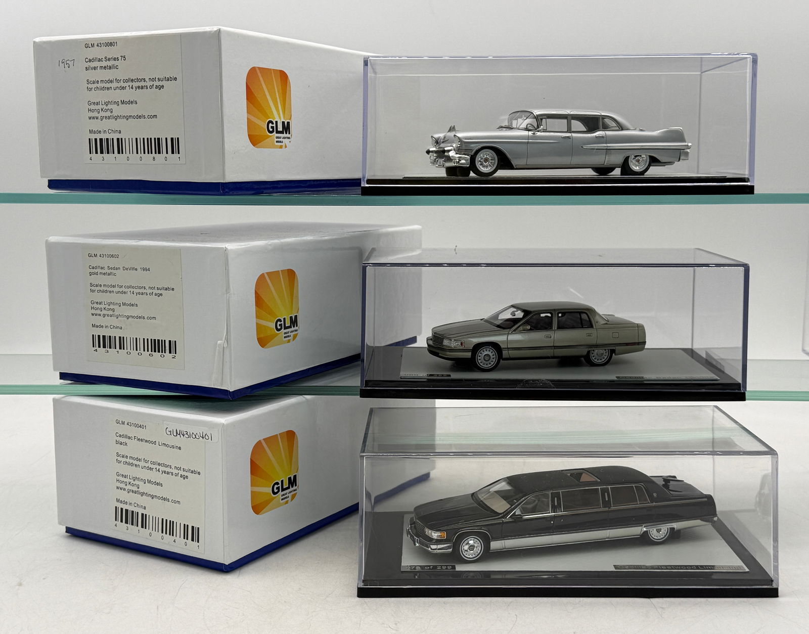 3 GLM Cadillac 1/43 Scale Model Cars: 3 GLM 1/43 scale resin Cadillac models including 4310081 1957 Cadillac number 27 of 299, 4310002 1994 Cadillac sedan Deville number 80 of 299, 43100401 Cadillac limousine number 176 of 299 OB's C9.