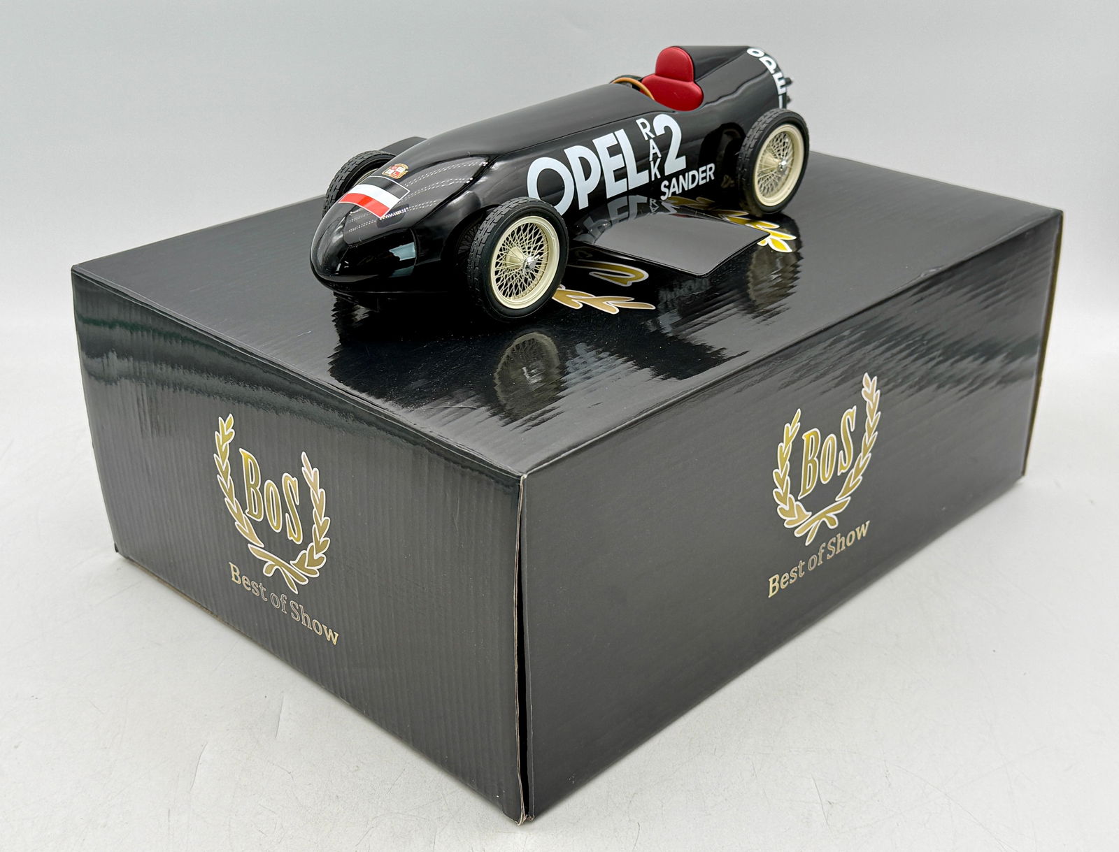 BoS-Models 078 Resin 1:18 Scale 1928 Opel RAK 2 Sander Rocket Car: A black 10 1/2 inch BoS-Models Opel RAK 2 Sander rocket car featuring a red interior and wire wheels, accompanied by its original branded storage box, 3770 of 1000, C9.