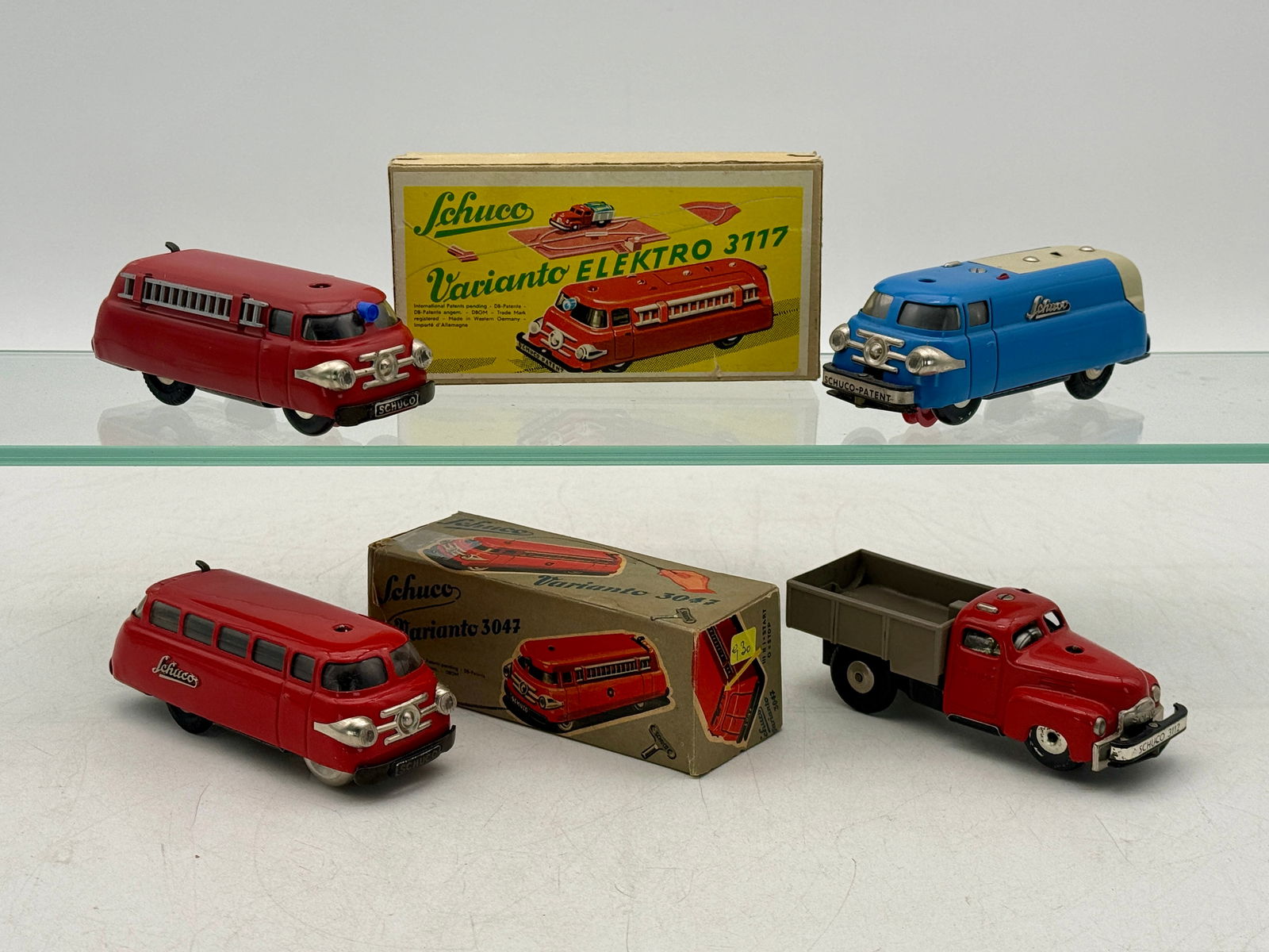 A Collection of Schuco Varianto Tinplate Toy Vehicles and Boxes (1 of 3)