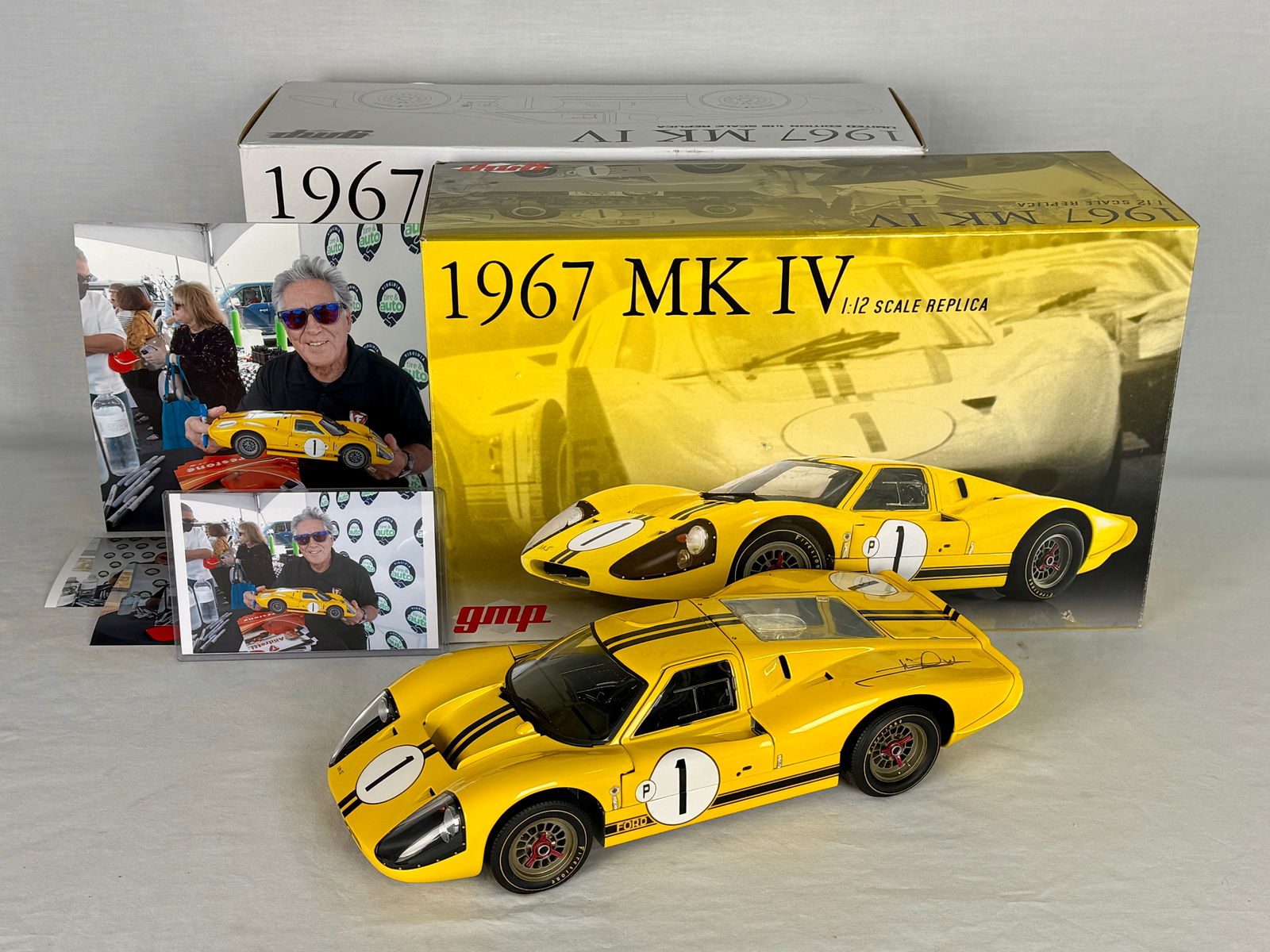 GMP 1:12 Scale 1967 Ford MK IV Signed Mario Andretti: A yellow 1:12 scale GMP replica of a 1967 Ford MK IV race car signed by Mario Andretti with original packaging and signing photographs, C9.