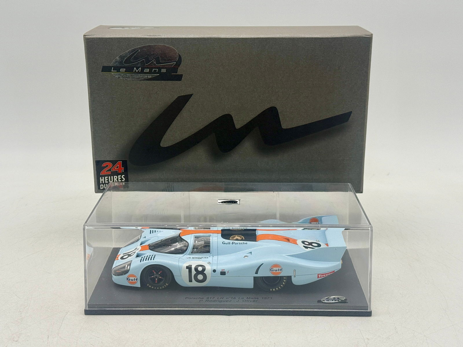 Le Mans Miniatures Gulf-Porsche 917 LH No. 18 Scale Model: A light blue and orange Gulf-Porsche 917 LH No. 18 scale model from the 1971 Le Mans race, driven by P. Rodriguez and J. Oliver, including its original display case and presentation box marked LMS018.
