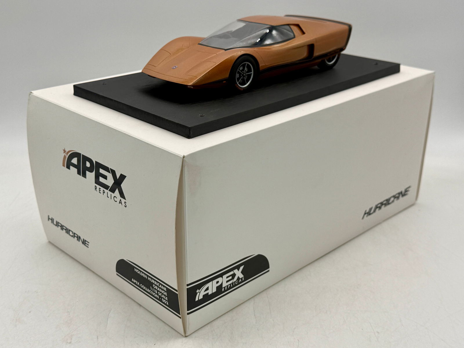 Apex Replicas #2 Scale Holden Hurricane 1969 Concept Car Orange: An orange resin 1:18 scale Apex Replicas Holden Hurricane 1969 concept car model mounted on a black display base with its original box. OB C9.