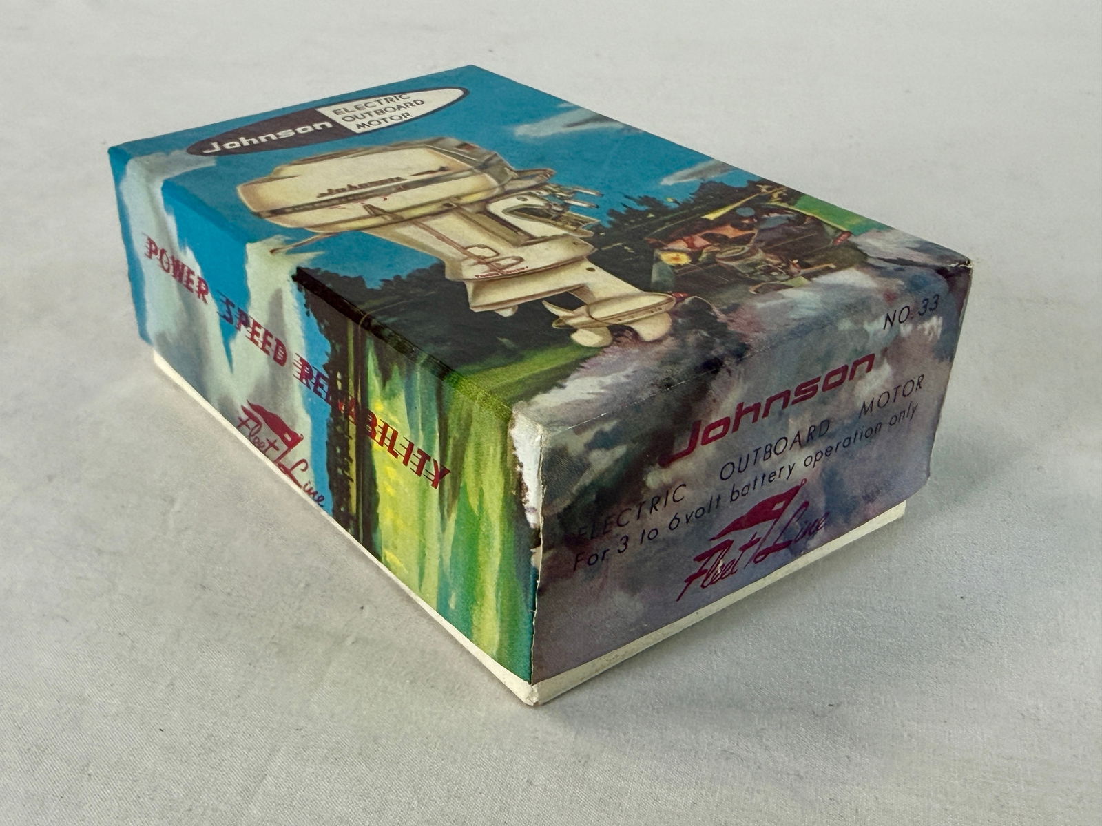 Fleet Line No. 33 Johnson Super Sea-Horse Toy Motor: A vintage white Fleet Line No. 33 Johnson Super Sea-Horse 35 electric outboard toy motor with its original illustrated box and instructions, C10.