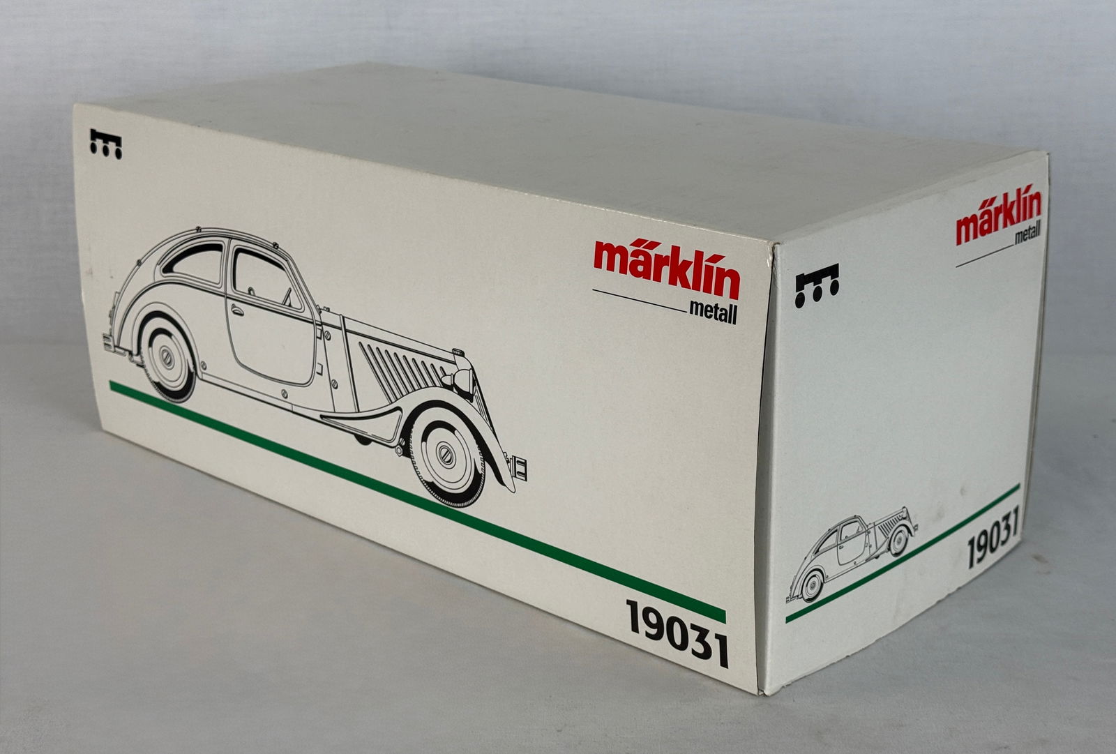 Marklin 19031 Metal Streamlined Coupe Model Car with Box: A green and beige M?¤rklin 19031 metal streamlined coupe model car 15 inches long featuring a clockwork mechanism and accompanied by its original box, styrofoam insert, and metal winding key with ele