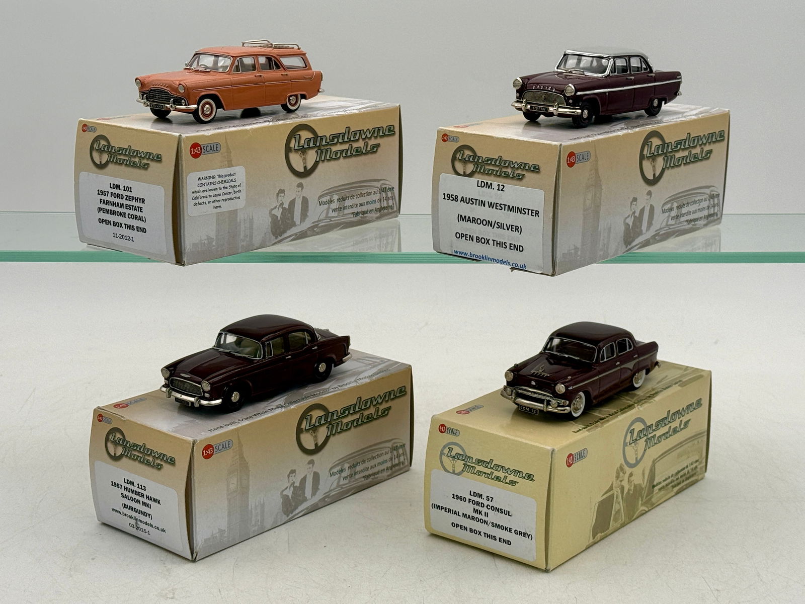 A Collection of 4 Lansdowne Models 1:43 Scale Metal Vehicles: A collection of four Lansdowne Models 1:43 scale white metal vehicles including a 1957 Ford Zephyr Farnham Estate, 1958 Austin Westminster, 1957 Humber Hawk Saloon MKI, and 1960 Ford Consul MK II, hou