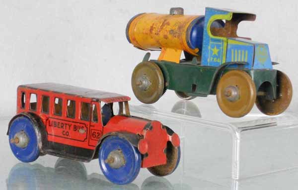 2 MARX TRUCKS: Aero Oil Company & Liberty Bus Co., litho tin, friction working, 5" & 5 1/4" long, tank truck rear axle loose on 1 side, oxidation on 1 side of truck, C5.