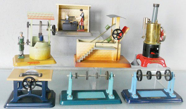 7 FLEISCHMANN STEAM TOYS: handpainted tin, Steam Engine, complete w/burner, Forge, Water Well, Sandloader, Table Saw, 2 Transmissions, 6 orig boxes only, 1 worn, C6-8.