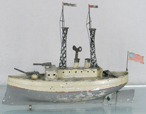 CARETTE 1914 WARSHIP: handpainted tin, windup working, twin screws, 15" long, paint flaking, w/girder cage masts, ex-Malcolm Forbes collection, C4-5.