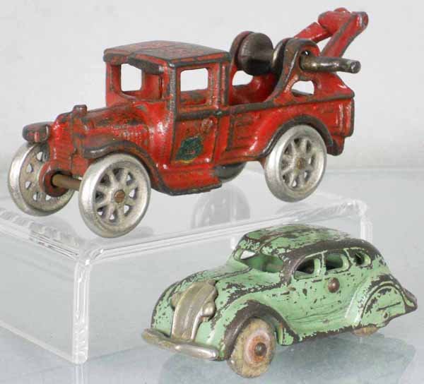 2 ARCADE VEHICLES: painted cast iron, Wrecker, 6" long, Airflow, 4" long, C4.
