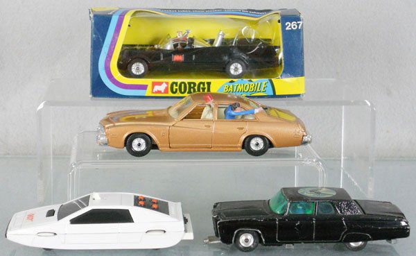 4 CORGI CHARACTER VEHICLES: 267 Batmobile, orig box minor wear, window torn, 290 Kojak's Buick, 269 James Bond Lotus Esprit, 268 Green Hornet Black Beauty, no missiles, 268 is C5, rest C8.