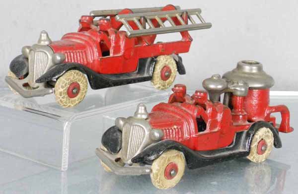 2 HUBLEY FIRE ENGINES: painted cast iron, Ladder Truck, rear fender broken, Pumper, both are 6 1/4" long & have worn rubber tires, C5-6.