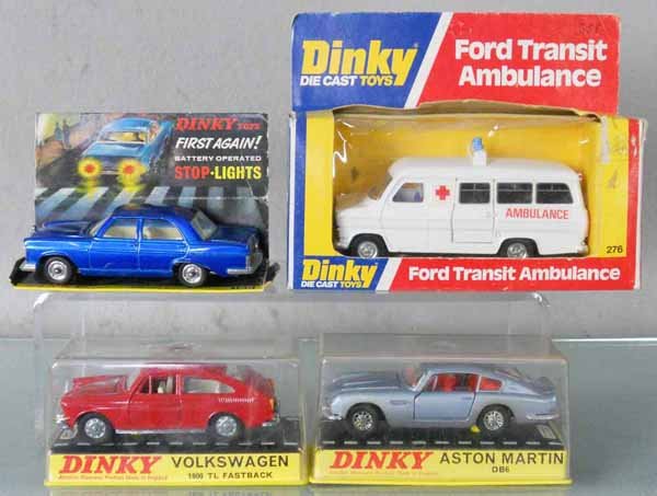4 DINKY VEHICLES: 163 Volkswagen 1600TL Fastback, some tarnishing to chrome, 153 Aston Martin DB6, missing headlights, paint discolored, 276 Ford Transit Ambulance, orig boxes, 1 worn, w/160 Mercedes Benz 250SE, w/orig