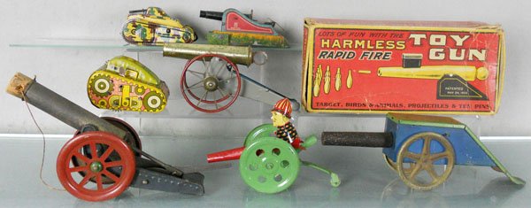 ARMY TOY LOT: Japanese Tank, working, 4" long, missing treads, Hess Cannon, 5" long, Marx Tank, 4" long, 4 Cannons, 1 repainted, 6 1/2" to 11" long, American Toy Cannon Set, some targets worn, C5-7.