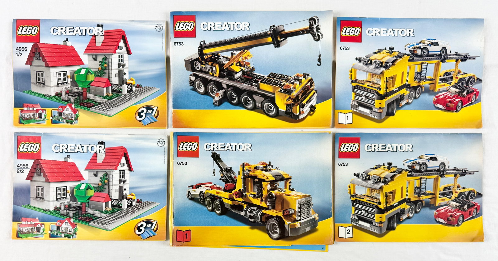 A Pair of LEGO Creator Sets, House 4956 and Highway Transport 6753: This lot features two sets from the LEGO Creator product line: Set 4956 House and Set 6753 Highway Transport. Set 4956 consists of various red, white, and grey plastic bricks and includes one green 32