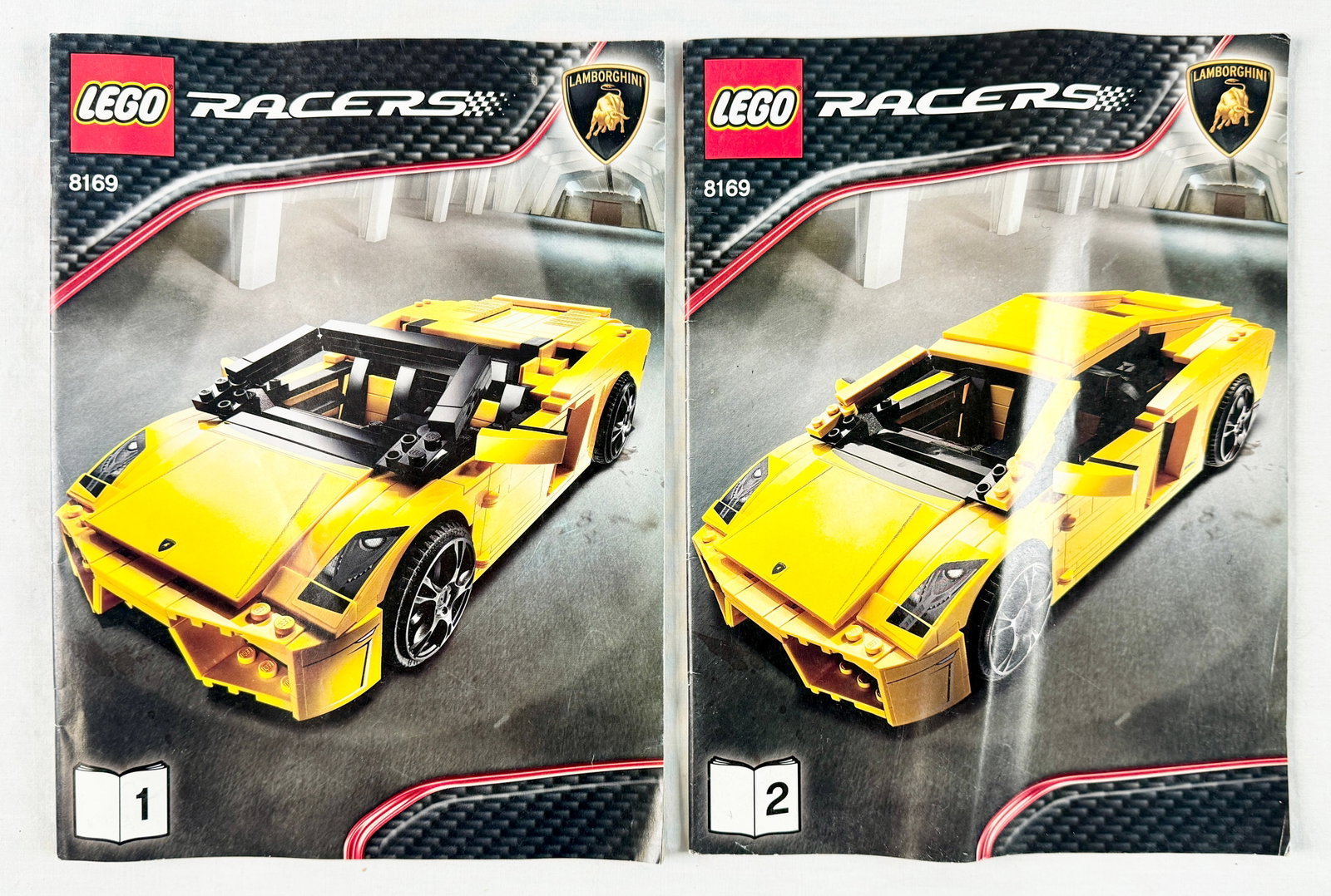 LEGO Racers Lamborghini Gallardo LP 560-4 Set 8169: This is a disassembled LEGO Racers Lamborghini Gallardo LP 560-4 construction set, set number 8169. Included are two original instruction manuals. Booklet 1 provides instructions for building the mode