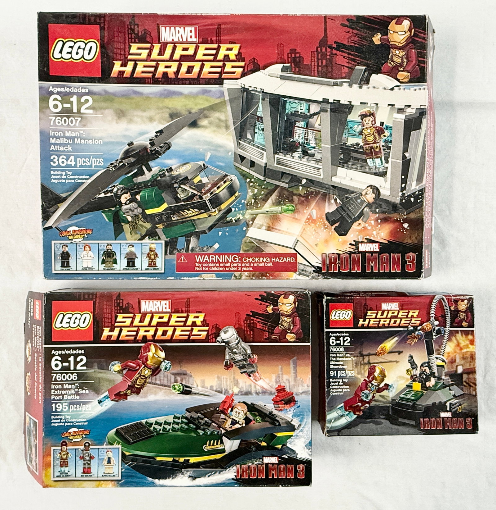 Three LEGO Marvel Super Heroes Iron Man 3 Sets 76006, 76007, 76008: This lot consists of three LEGO Marvel Super Heroes sets based on the film Iron Man 3, featuring the Malibu Mansion Attack (76007), Extremis Sea Port Battle (76006), and Iron Man vs. The Mandarin: