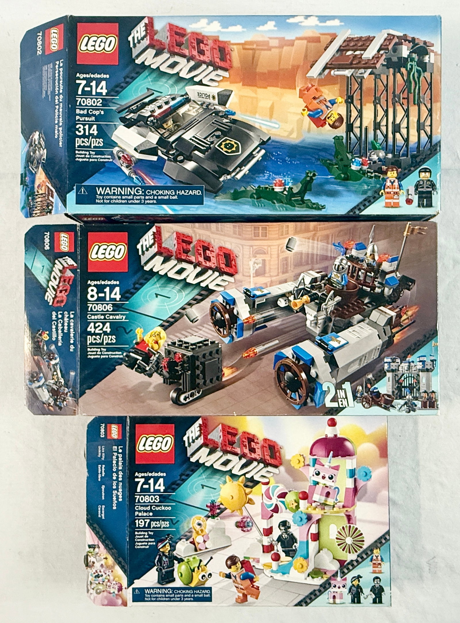 Three The LEGO Movie Construction Sets including 70802 Bad Cop's Pursuit, 70806 Castle Cavalry, and (1 of 4)