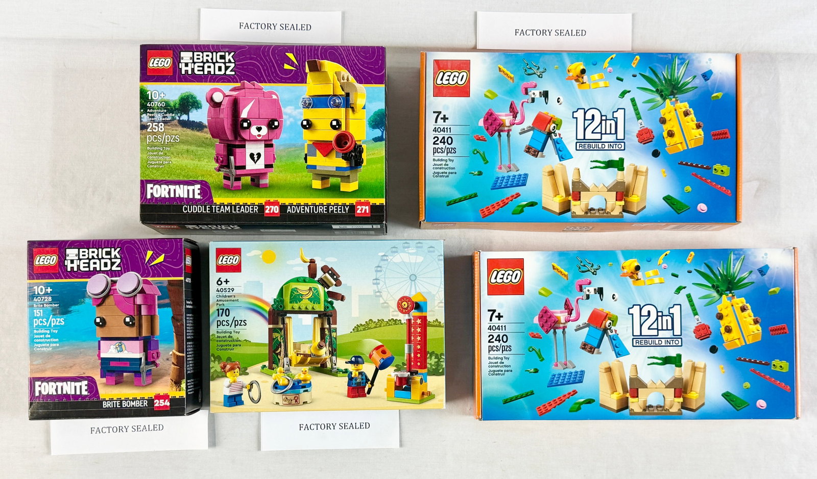 A Collection of Five LEGO Construction Sets Including Fortnite BrickHeadz and Promotional Kits (1 of 3)
