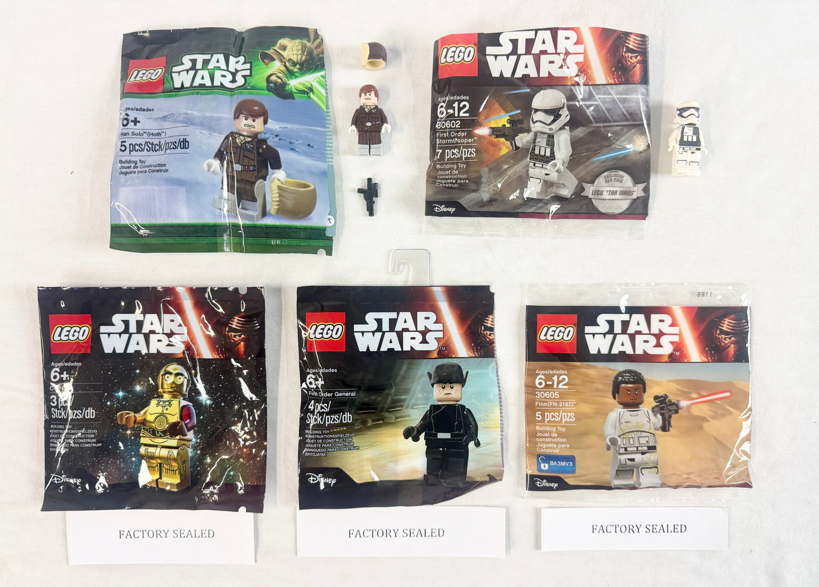 Collection of 5 LEGO Star Wars Promotional Minifigure Polybag Sets: This group consists of five promotional LEGO Star Wars minifigure polybag sets manufactured by the LEGO Group between 2013 and 2016. Each set features a single minifigure with relevant accessories as 