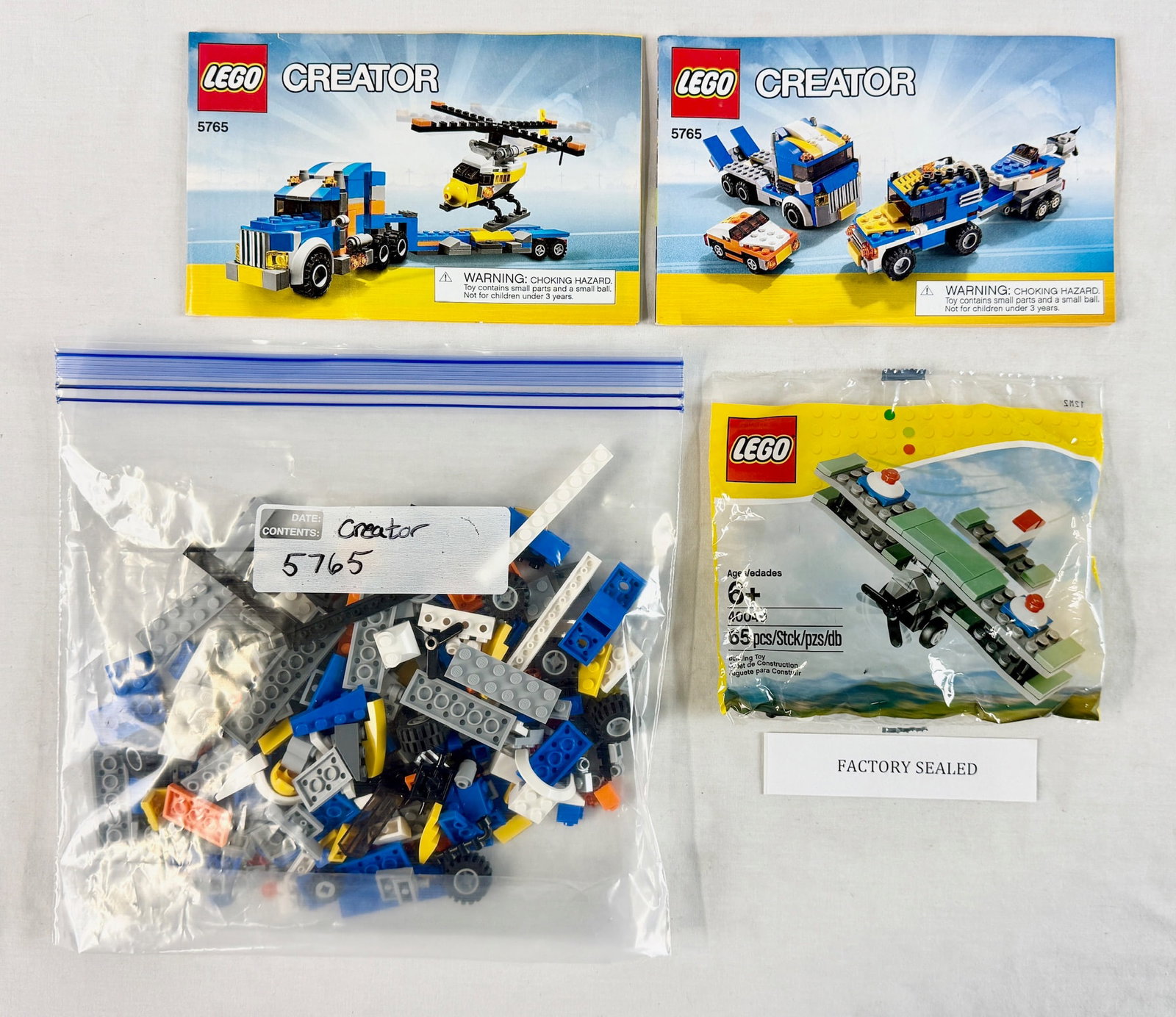 A Pair of LEGO Creator Construction Toy Sets including Transport Truck 5765 and Bi-Plane 30043 (1 of 2)