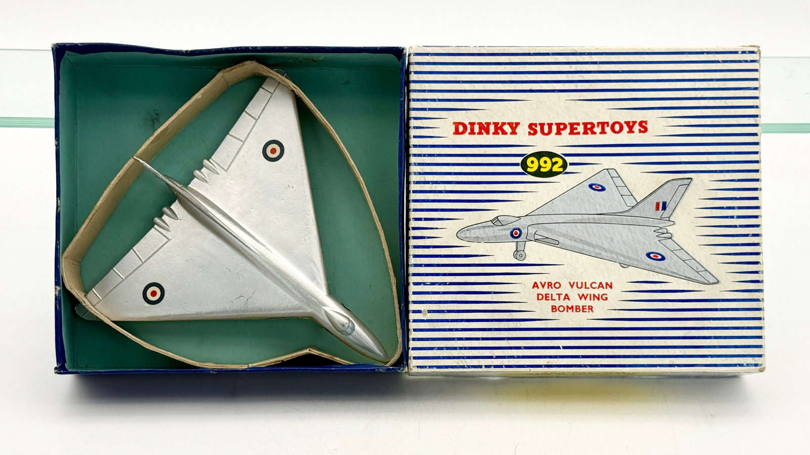 Dinky Supertoys Number 992 Avro Vulcan Delta Wing Bomber: A Dinky Supertoys No. 992 Avro Vulcan Delta Wing Bomber in silver-finished die-cast metal. The model displays authentic Royal Air Force roundel and fin flash decals and is accompanied by its original 