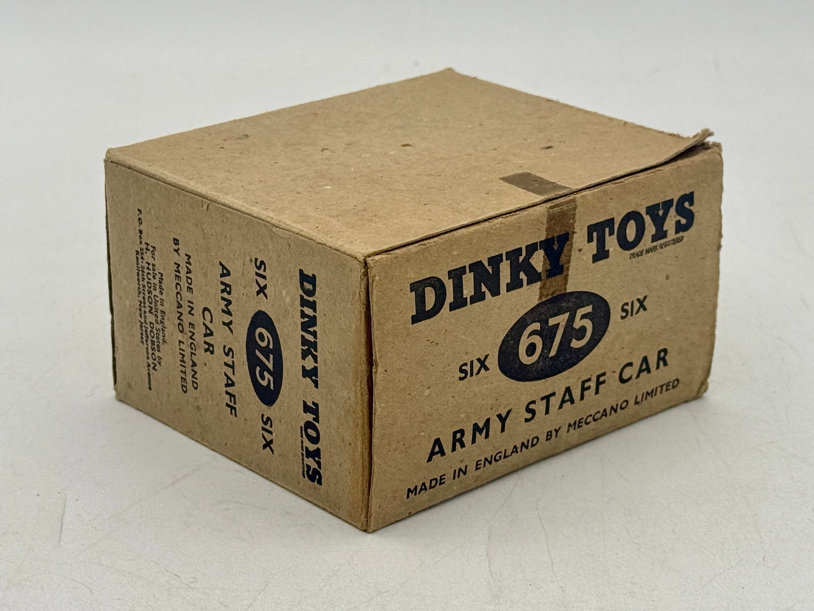 6 Dinky Toys No. 675 Army Staff Cars in trade box: Manufactured in England by Meccano Limited, this collection of die-cast military vehicles is finished in matte olive drab with white star markings. Each model is presented in its original individual y