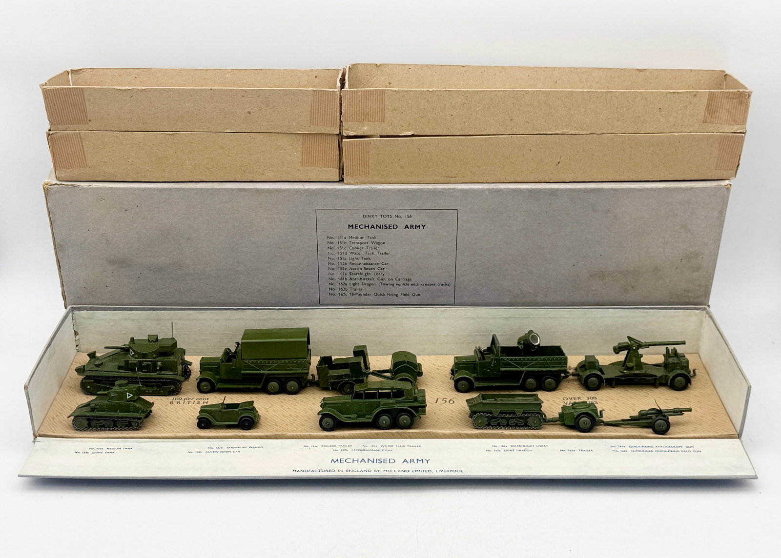 Pre-war Dinky Toys No. 156 Mechanised Army Gift Set: A pre-war Dinky Toys No. 156 Mechanised Army set featuring die-cast military vehicles and artillery pieces produced by Meccano Limited. The set comprises olive drab models including a medium tank, lig
