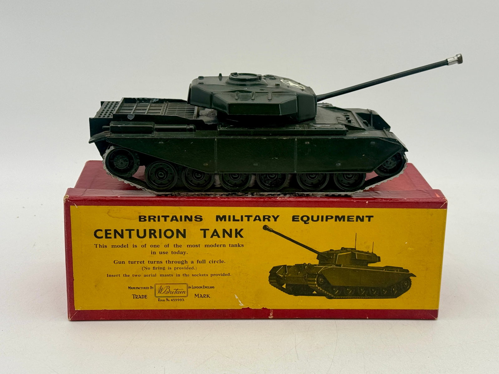 Britains Model No. 2150 Centurion Tank with Original Box: This Britains No. 2150 Centurion Tank is constructed from die-cast metal with a dark green finish and turret star insignia. The model features a fully rotating turret and an elevating gun barrel suppo