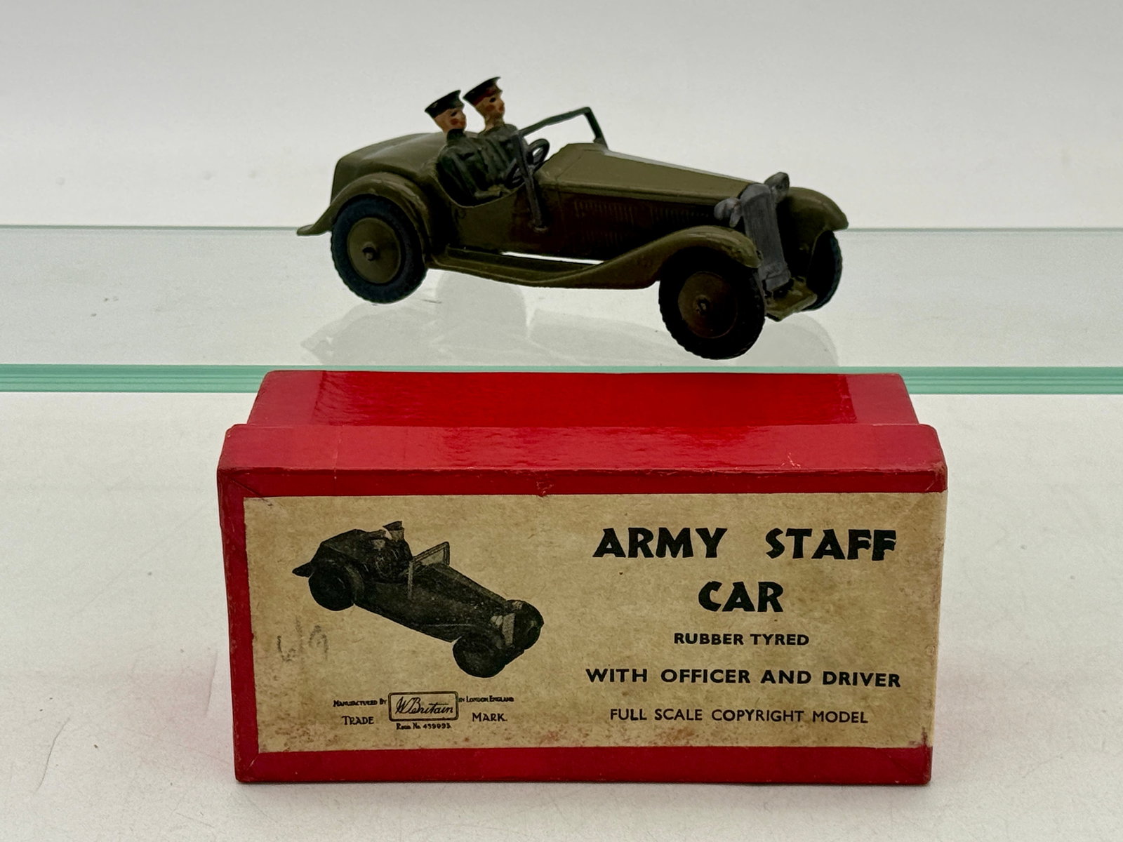 Britains No. 1448 Die-Cast Army Staff Car and Original Box: This Britains No. 1448 Army Staff Car is a die-cast metal model finished in olive drab. It features two original hand-painted lead figures representing an officer and a driver along with original blac