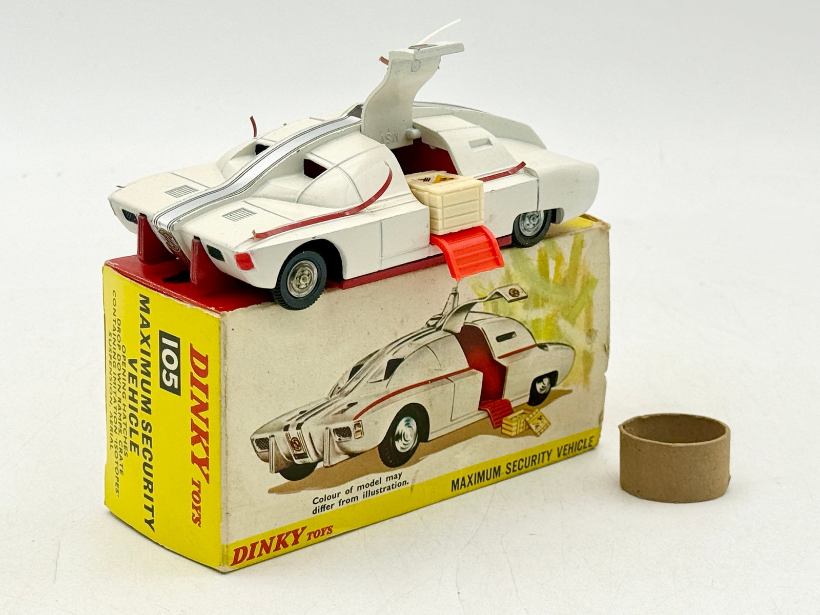 Dinky Toys 105 Captain Scarlet Maximum Security Vehicle with Box: Dinky Toys 105 Maximum Security Vehicle is a die-cast model based on the Captain Scarlet and the Mysterons television series. The vehicle features a white paint finish with red adhesive strips, Spectr