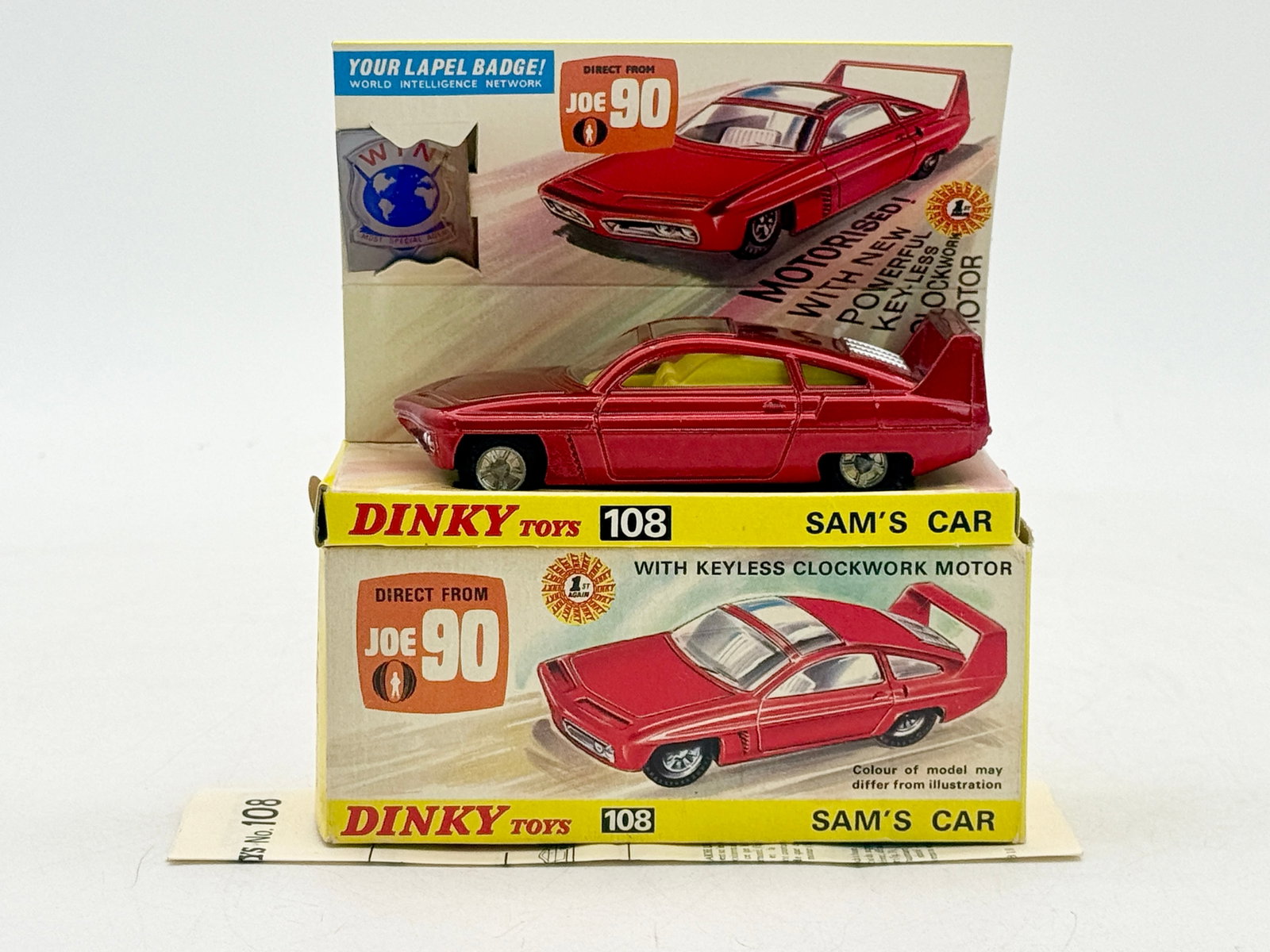 Dinky Toys No. 108 Sam's Car From Joe 90 Boxed: A Dinky Toys No. 108 Sam's Car die-cast model finished in metallic red with a keyless clockwork motor. Modeled after the vehicle from the Gerry Anderson television series Joe 90, the set is complete w