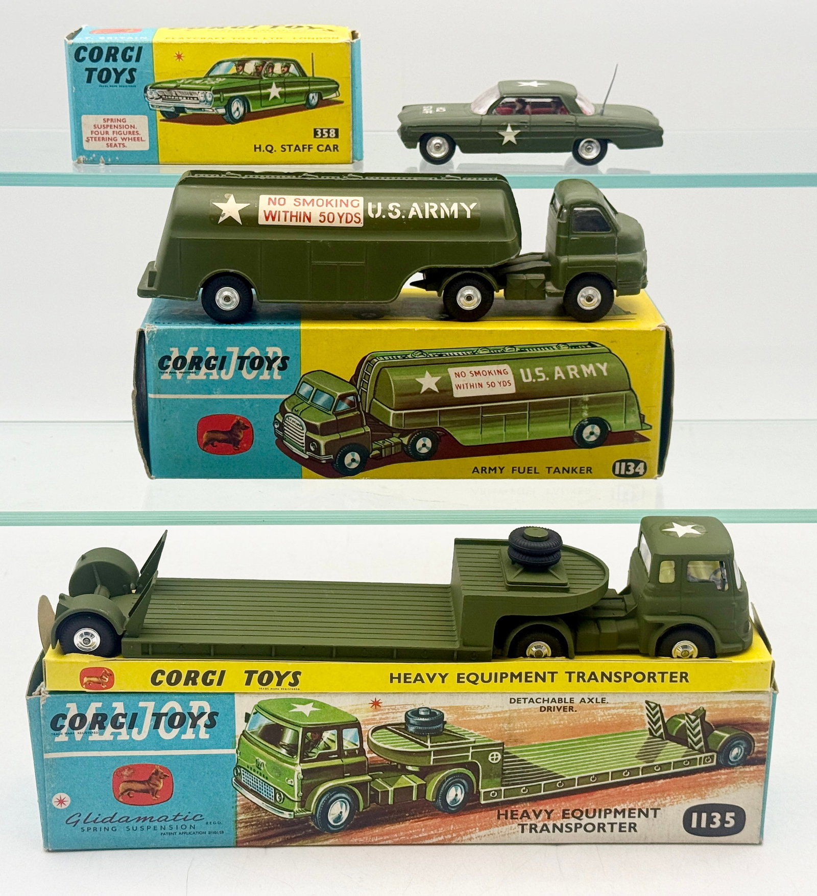Trio of Vintage Corgi Military Vehicles in Original Boxes: This collection features three Corgi and Corgi Major die-cast military vehicles produced by Playcraft Toys Ltd. in Great Britain. The group includes an Oldsmobile H.Q. Staff Car, a Bedford S Type Army