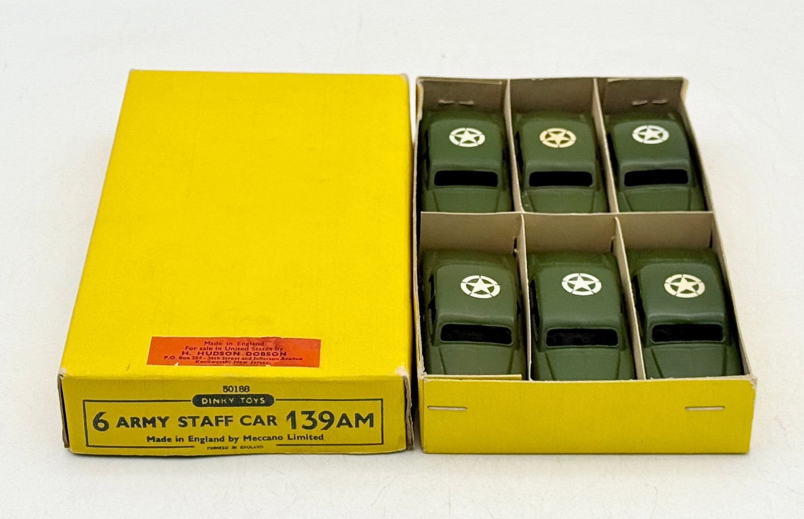 6 Dinky Toys 139AM Army Staff Cars in Trade box: A set of six die-cast Dinky Toys model 139AM Army Staff Cars manufactured in England by Meccano Limited. Each vehicle is finished in olive green with white star decals and is presented in the original