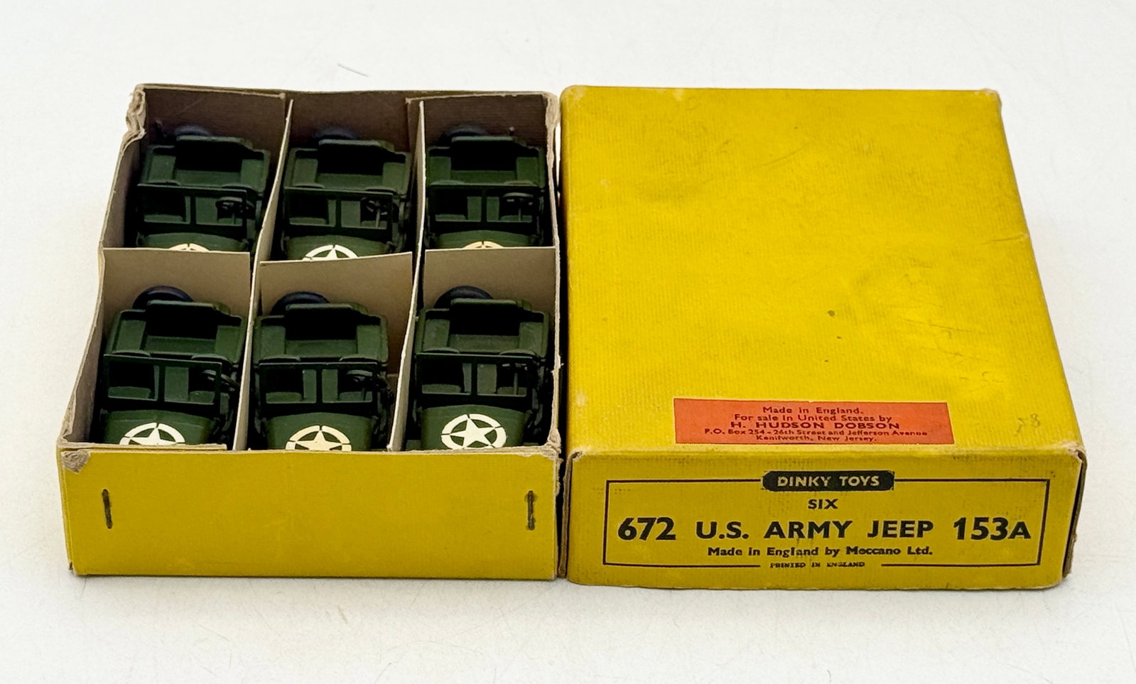 Dinky Toys No. 672 US Army Jeep Trade Box Set of 6: Dinky Toys No. 672 collection of die-cast metal US Army Jeeps finished in olive drab green. Each 153A model features white star decals on the hood and sides along with a rear-mounted spare tire and fu