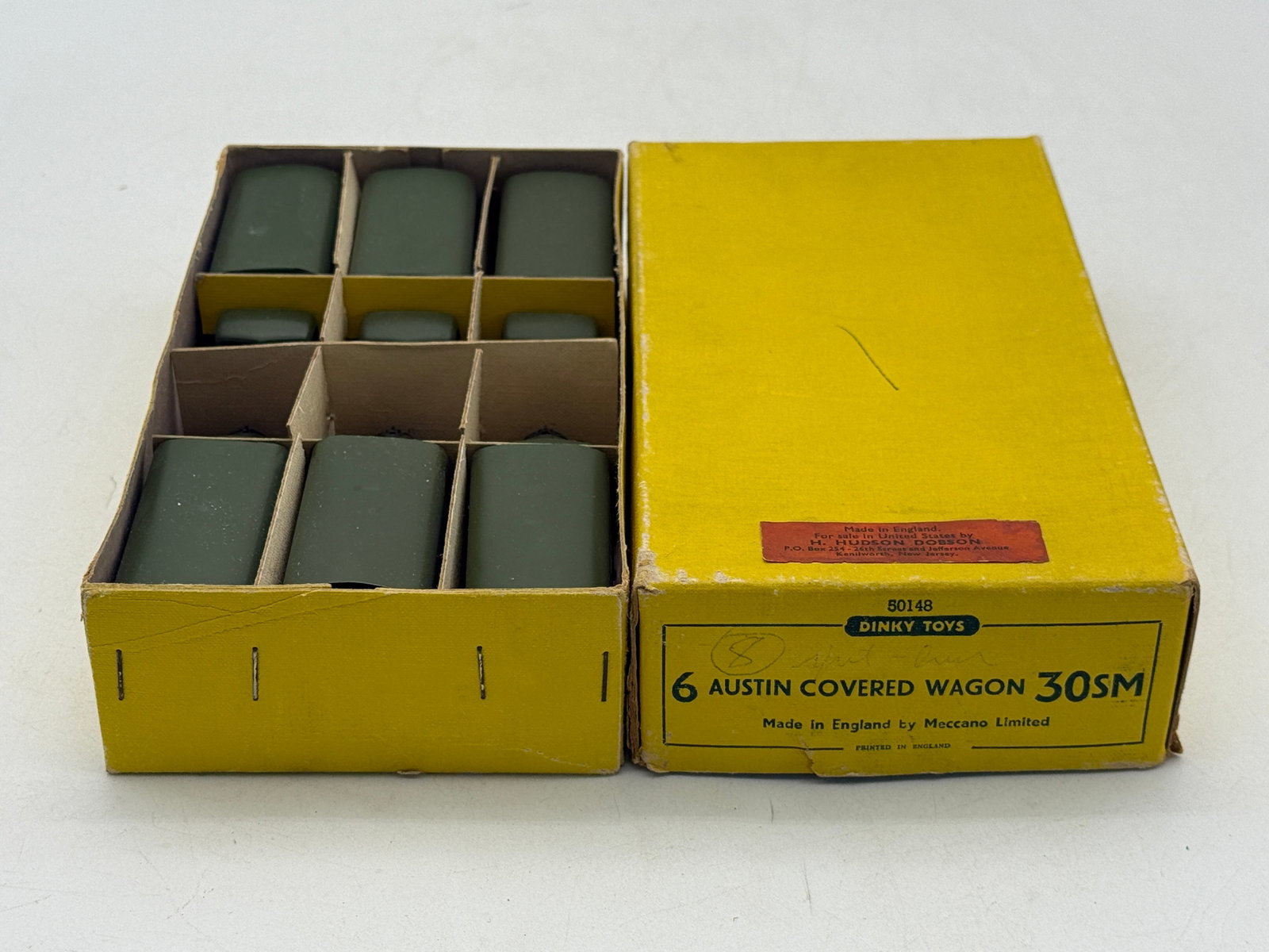 Dinky Toys 50148 Set of 6 Austin Covered Wagons in Trade box: This set of six Dinky Toys Austin Covered Wagons, model 30SM (50148), features die-cast metal bodies finished in olive drab military green. Each truck includes a removable matching green canopy and bl