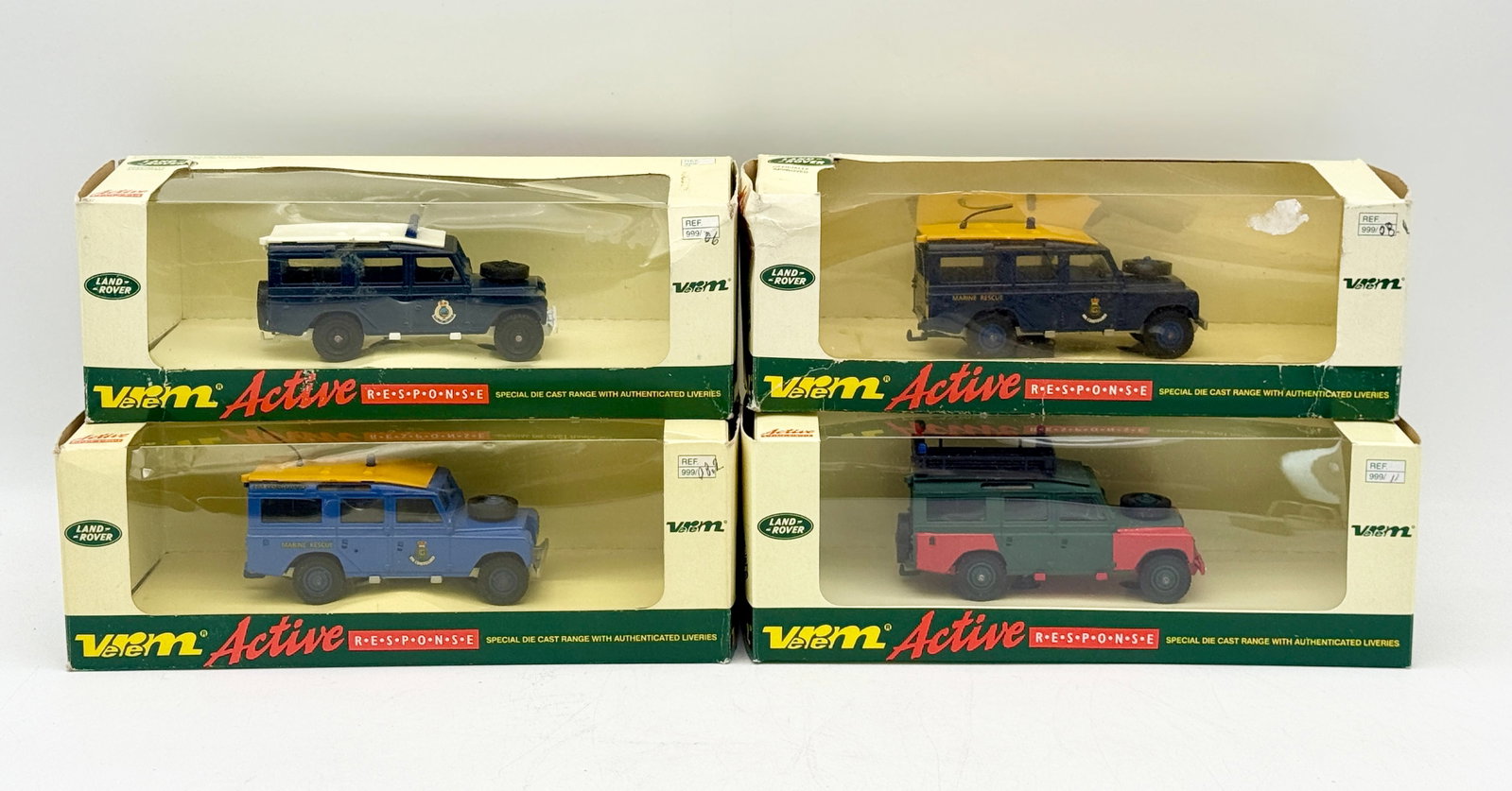 A Group of Verem Active Response Die-Cast Land Rovers: A group of Verem die-cast Land Rover models from the Active Response series. Each vehicle is constructed of metal and plastic, featuring specialized liveries for Marine Rescue, Police, and Explosive D