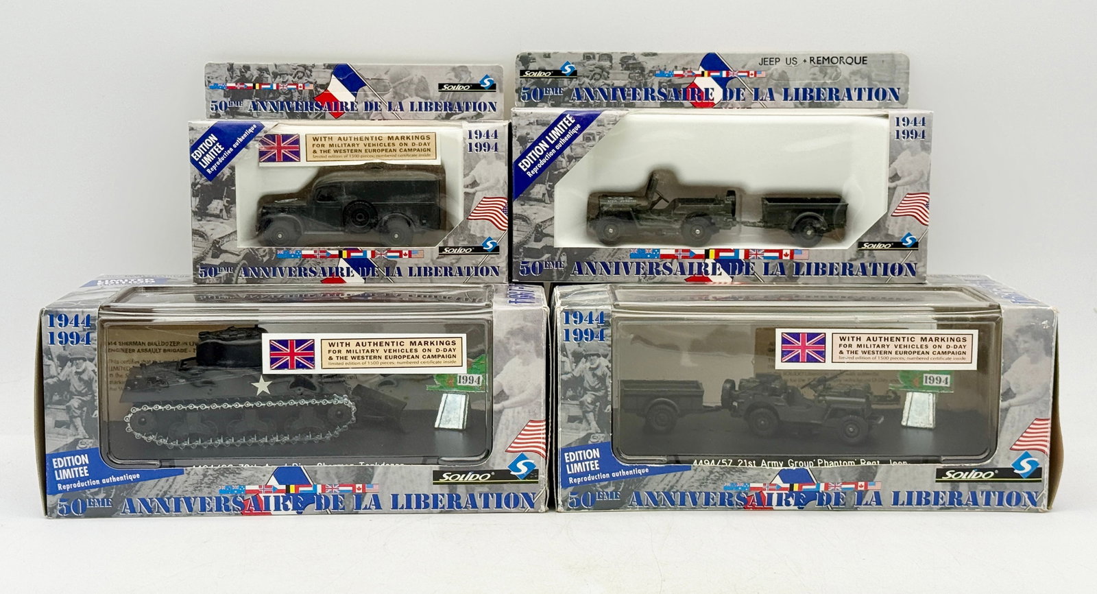 A Group of Solido 50th Anniversary Military Vehicle Models: A group of Solido die-cast military vehicle models produced for the 50th Anniversary of the Liberation. Each olive drab model features authentic Allied markings and is housed in its original commemora